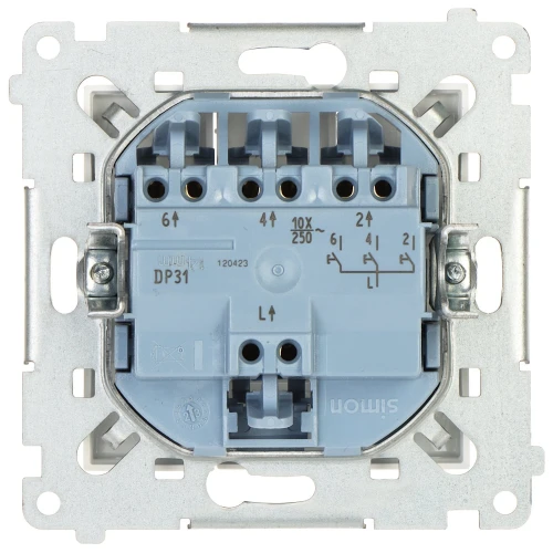 Na zdjęciu znajduje się metalowy mechanizm łącznika elektrycznego z widocznymi zaciskami i oznaczeniami technicznymi. Element jest osadzony w metalowej ramce montażowej.