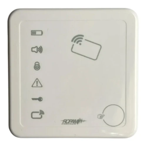 Na zdjęciu znajduje się biały czytnik kart zbliżeniowych z kilkoma ikonami na przedniej stronie, w tym symbolem karty, głośnika, klucza i ostrzeżenia. Urządzenie ma prostokątny kształt i zaokrąglone rogi.