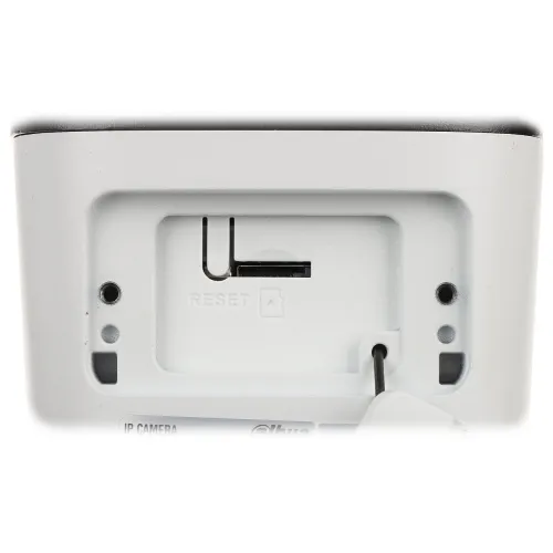 Zbliżenie na gniazdo karty pamięci oraz przycisk reset w urządzeniu elektronicznym. Widoczne są otwory montażowe i oznaczenia na białej obudowie.