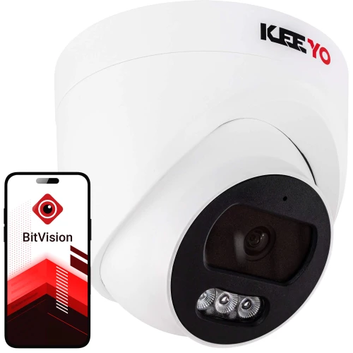 Biała kopułowa kamera IP z czarnym panelem frontowym i dwoma diodami IR, obok której znajduje się smartfon z aplikacją BitVision na ekranie. Kamera ma nowoczesny design i jest przeznaczona do monitoringu wizyjnego.