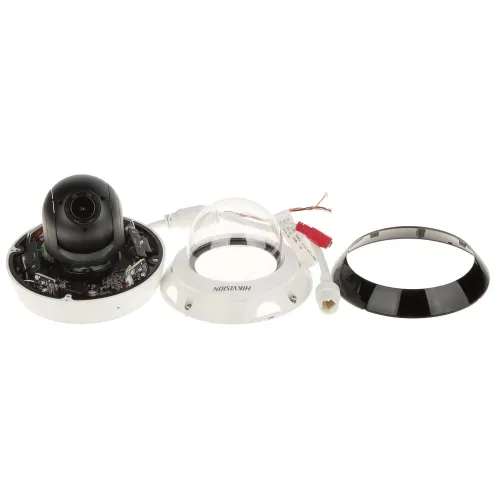 Zdjęcie przedstawia rozłożoną kamerę monitoringu z widocznymi elementami: obudową, kopułą i okablowaniem. Na środku znajduje się czarny moduł kamery, a wokół niego białe i czarne części obudowy.