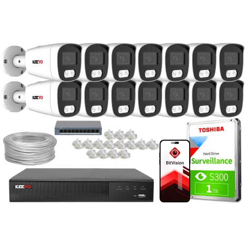 Zestaw do monitoringu składający się z szesnastu kamer, rejestratora, dysku twardego Toshiba o pojemności 1 TB, kabla sieciowego, złączek oraz smartfona z aplikacją BitVision. Kamery są białe z czarnymi frontami, a rejestrator i dysk są oznaczone logotypami producentów.